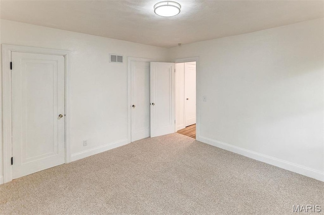 14 Carson Dr, Belleville, IL 62223 - unfurnished bedroom with carpet flooring, baseboards, and a closet