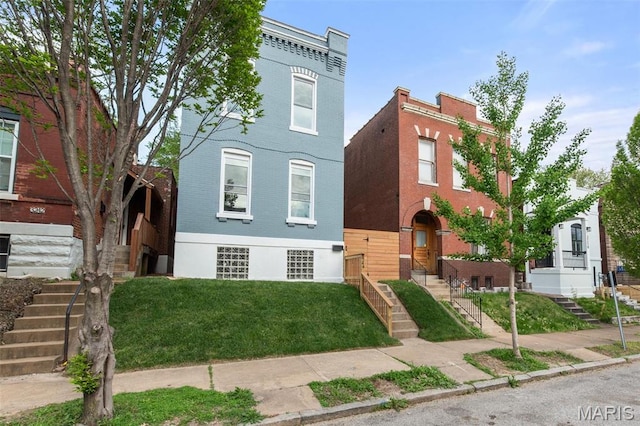 3244 Michigan Ave, Saint Louis, MO 63118 - townhome / multi-family property featuring stairway and brick siding