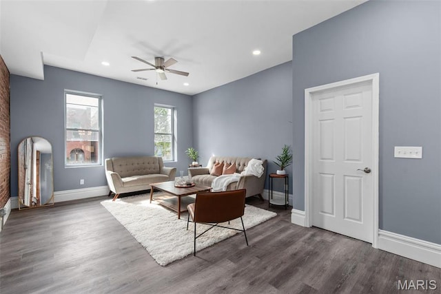 3244 Michigan Ave, Saint Louis, MO 63118 - living room featuring a ceiling fan, dark wood-type flooring, baseboards, recessed lighting, and arched walkways