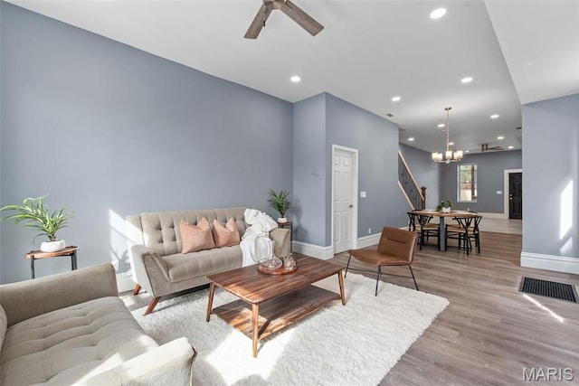 3244 Michigan Ave, Saint Louis, MO 63118 - living area with recessed lighting, a chandelier, baseboards, a ceiling fan, and wood finished floors