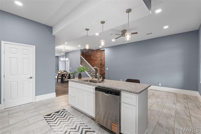3244 Michigan Ave, Saint Louis, MO 63118 - kitchen featuring stainless steel dishwasher, a sink, a ceiling fan, white cabinetry, and baseboards