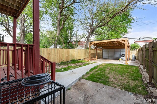 3244 Michigan Ave, Saint Louis, MO 63118 - fenced backyard with a detached garage and an outbuilding