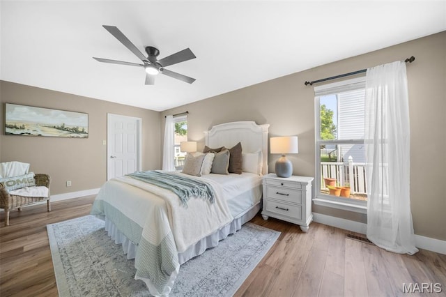 2222 Harborside Dr, Ofallon, MO 63368 - bedroom featuring baseboards, wood finished floors, and ceiling fan