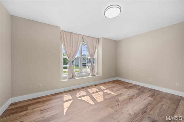 2222 Harborside Dr, Ofallon, MO 63368 - empty room with wood finished floors and baseboards