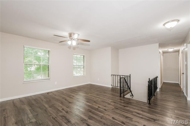 3124 Pinebrook Dr, Arnold, MO 63010 - empty room with dark wood-style floors, ceiling fan, and baseboards