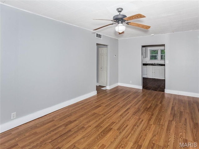 123 E Charter St, Troy, IL 62294 - spare room with ceiling fan, baseboards, and wood finished floors