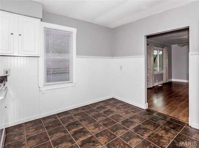 123 E Charter St, Troy, IL 62294 - unfurnished dining area with a wainscoted wall