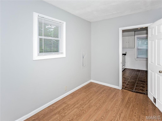 123 E Charter St, Troy, IL 62294 - spare room featuring baseboards and wood finished floors