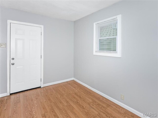 123 E Charter St, Troy, IL 62294 - unfurnished room featuring baseboards and wood finished floors