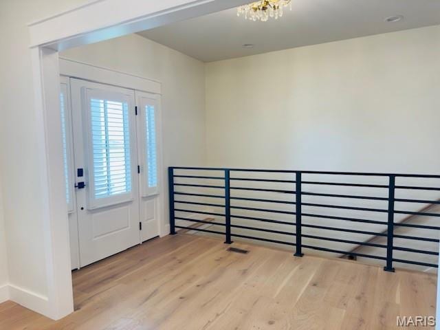 242 Orange Bowl Dr, Cape Girardeau, MO 63701 - foyer with light wood finished floors, a chandelier, and baseboards