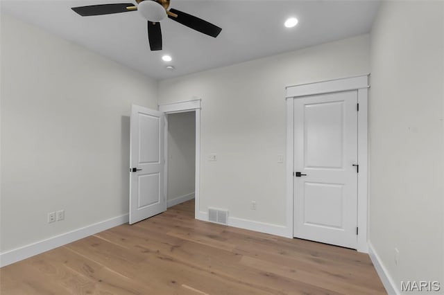 242 Orange Bowl Dr, Cape Girardeau, MO 63701 - unfurnished bedroom with wood finished floors, baseboards, recessed lighting, and a ceiling fan
