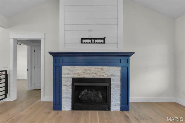 242 Orange Bowl Dr, Cape Girardeau, MO 63701 - detailed view of baseboards, wood finished floors, and a fireplace