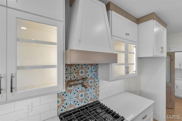 242 Orange Bowl Dr, Cape Girardeau, MO 63701 - kitchen with decorative backsplash, custom range hood, white cabinetry, and light stone countertops
