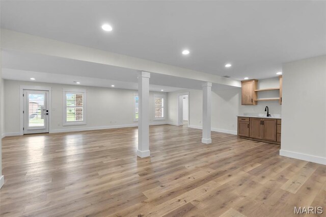 242 Orange Bowl Dr, Cape Girardeau, MO 63701 - below grade area with wet bar, light wood-type flooring, recessed lighting, and baseboards