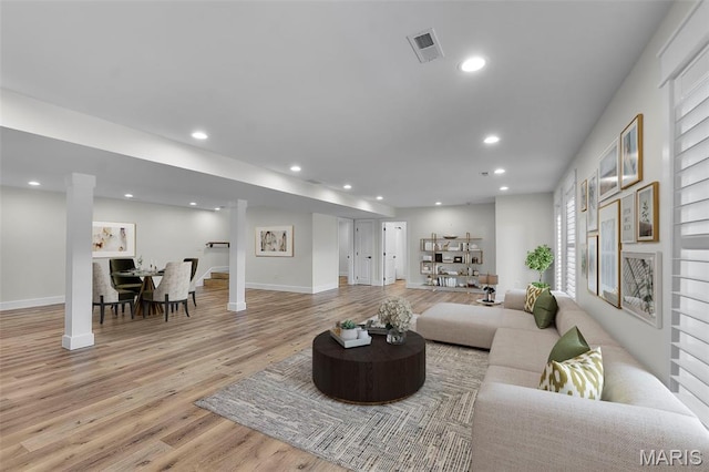 242 Orange Bowl Dr, Cape Girardeau, MO 63701 - living area featuring light wood-style flooring, decorative columns, recessed lighting, and baseboards