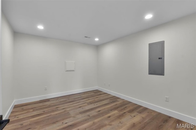 242 Orange Bowl Dr, Cape Girardeau, MO 63701 - empty room featuring electric panel, wood finished floors, recessed lighting, and baseboards