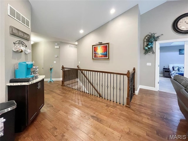 9794 Cedar Dr, Hillsboro, MO 63050 - corridor featuring an upstairs landing, lofted ceiling, light wood-style floors, baseboards, and recessed lighting