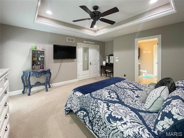 9794 Cedar Dr, Hillsboro, MO 63050 - bedroom with a raised ceiling, light colored carpet, baseboards, recessed lighting, and ensuite bath