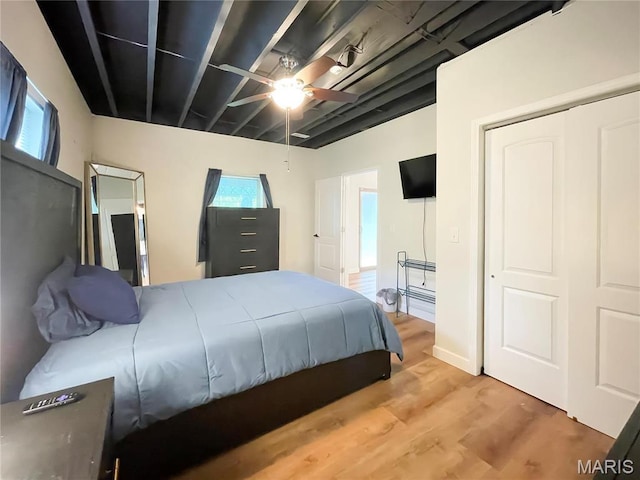 9794 Cedar Dr, Hillsboro, MO 63050 - bedroom with wood finished floors, a ceiling fan, and a closet