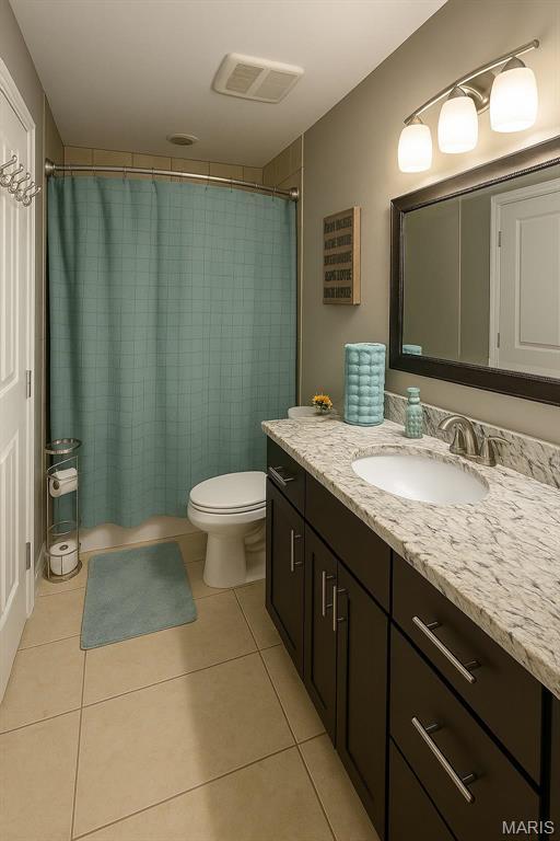 9794 Cedar Dr, Hillsboro, MO 63050 - bathroom with tile patterned flooring, toilet, and vanity