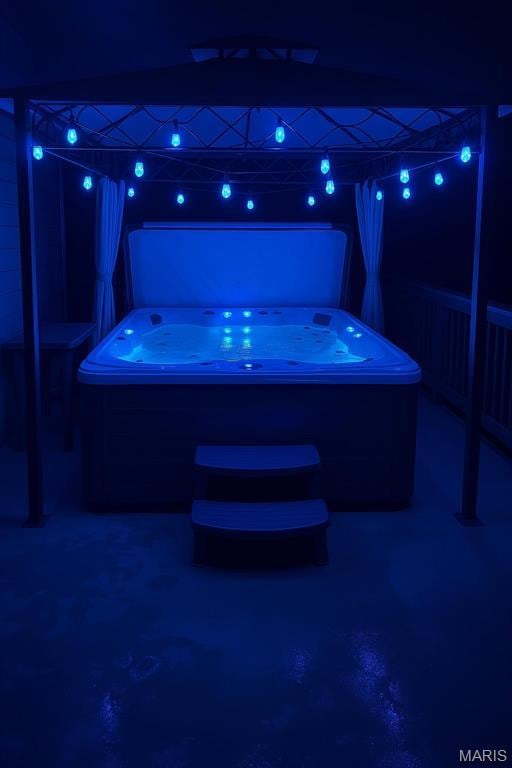 9794 Cedar Dr, Hillsboro, MO 63050 - patio at twilight featuring a hot tub