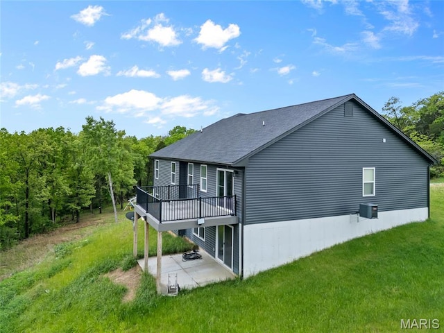 764 Red Clover Dr, Cedar Hill, MO 63016 - back of house with a patio area, a yard, a wooden deck, and a shingled roof