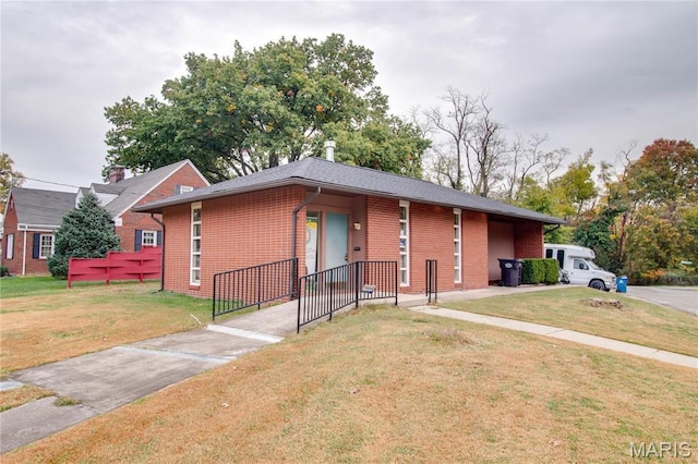 view of front of home featuring brick siding and a front yard