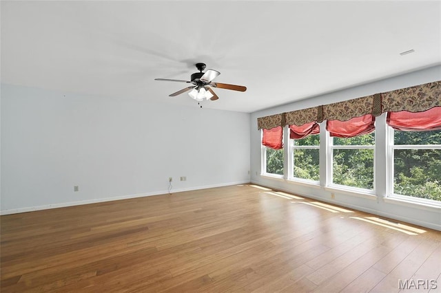 6144 Misty Meadow Dr, House Springs, MO 63051 - empty room featuring wood finished floors and a ceiling fan