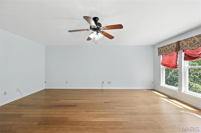 6144 Misty Meadow Dr, House Springs, MO 63051 - unfurnished room with wood finished floors and a ceiling fan