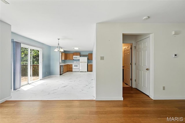 6144 Misty Meadow Dr, House Springs, MO 63051 - unfurnished living room with baseboards and a chandelier