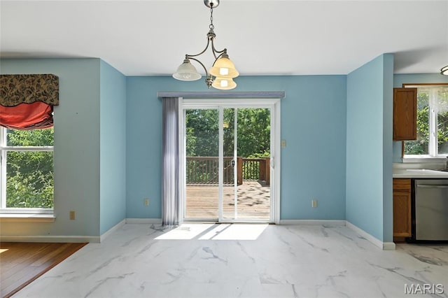 6144 Misty Meadow Dr, House Springs, MO 63051 - unfurnished dining area featuring healthy amount of natural light and light marble finish floors