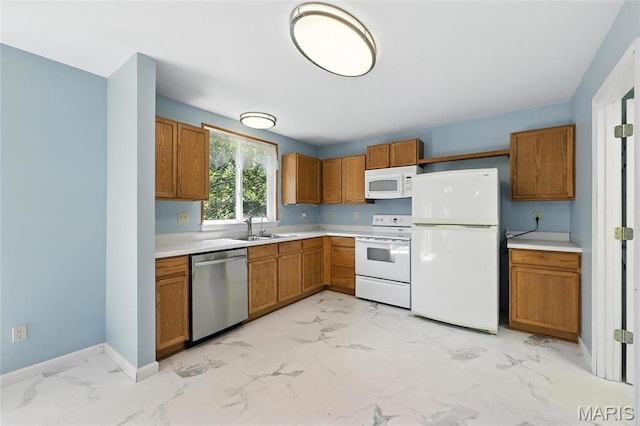 6144 Misty Meadow Dr, House Springs, MO 63051 - kitchen with white appliances, light marble finish flooring, light countertops, and brown cabinetry