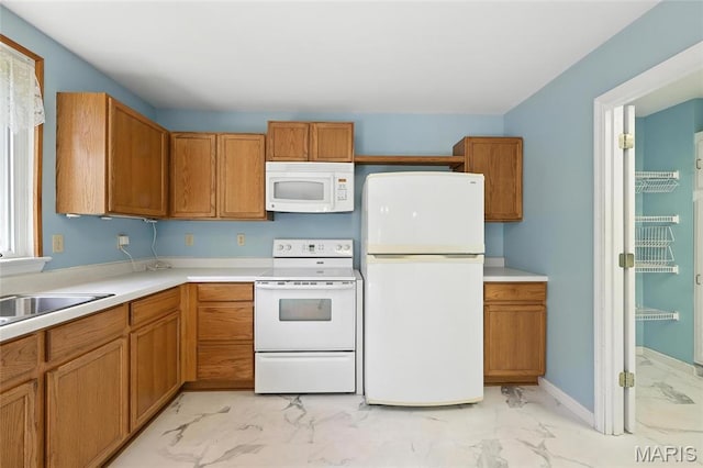 6144 Misty Meadow Dr, House Springs, MO 63051 - kitchen featuring white appliances, light marble finish floors, and brown cabinets