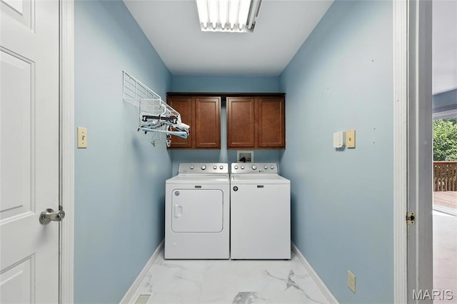 6144 Misty Meadow Dr, House Springs, MO 63051 - washroom with cabinet space, separate washer and dryer, and light marble finish floors