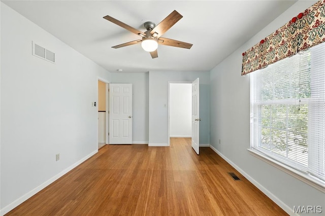 6144 Misty Meadow Dr, House Springs, MO 63051 - unfurnished bedroom with wood finished floors and ceiling fan