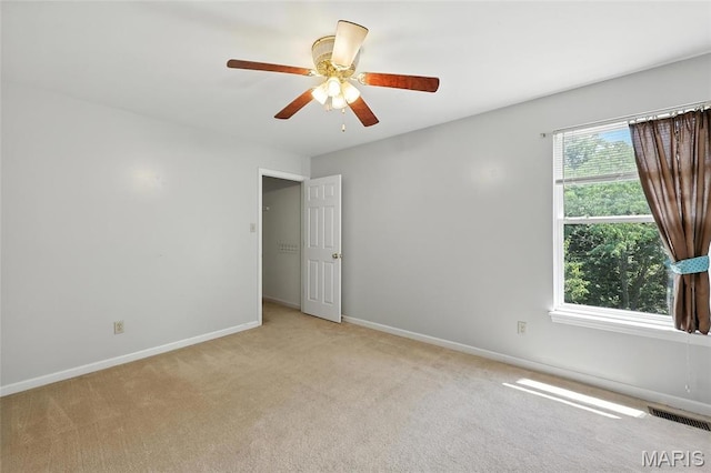 6144 Misty Meadow Dr, House Springs, MO 63051 - empty room with light colored carpet and a ceiling fan