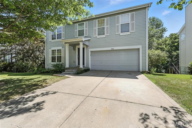 6144 Misty Meadow Dr, House Springs, MO 63051 - traditional home featuring a garage, concrete driveway, and a front yard