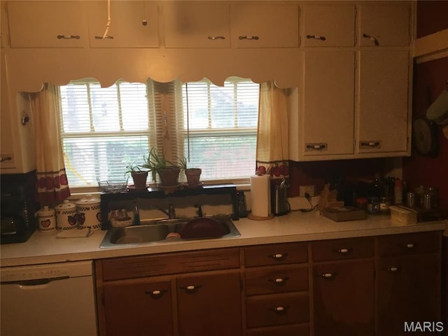 504 S Hickory St S, Cuba, MO 65453 - kitchen with dishwasher, a sink, light countertops, and healthy amount of natural light