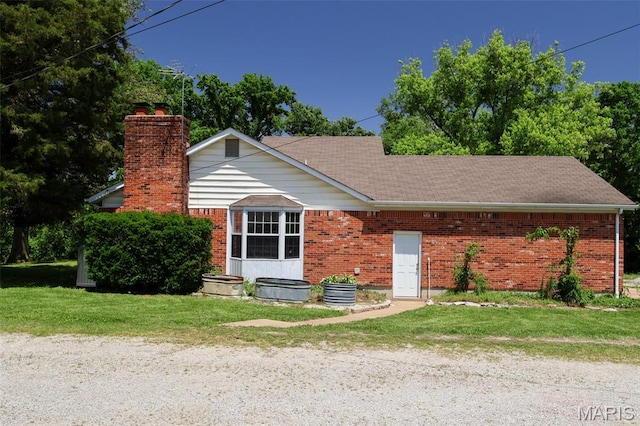 5501 Dober Ln, Saint Louis, MO 63129 - single story home with a chimney, brick siding, and a front lawn