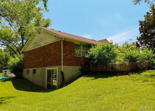 5501 Dober Ln, Saint Louis, MO 63129 - view of property exterior featuring a yard and brick siding