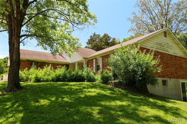 5501 Dober Ln, Saint Louis, MO 63129 - ranch-style home featuring brick siding and a front yard