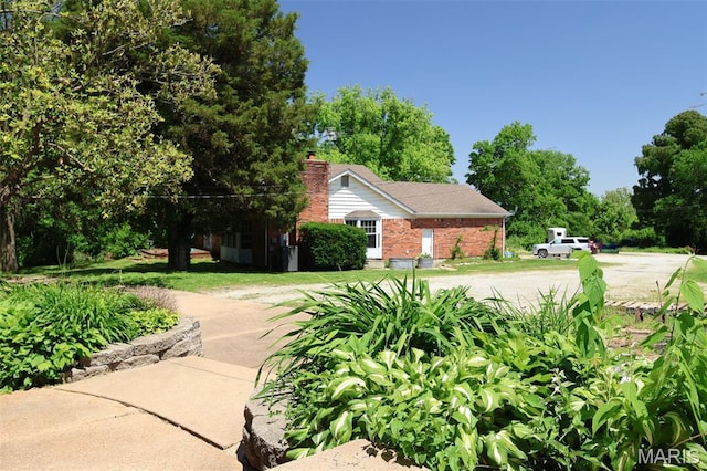 5501 Dober Ln, Saint Louis, MO 63129 - view of property exterior with brick siding and a chimney