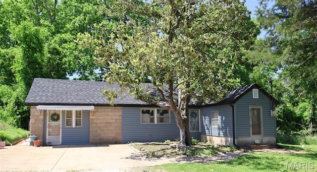 5501 Dober Ln, Saint Louis, MO 63129 - single story home with roof with shingles and a patio