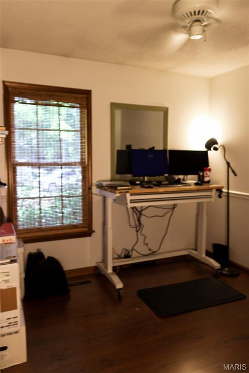 5501 Dober Ln, Saint Louis, MO 63129 - exercise area featuring a ceiling fan, wood finished floors, and baseboards