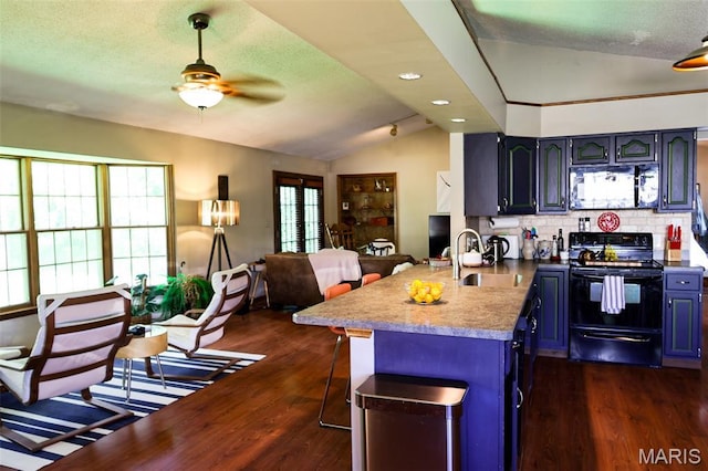 5501 Dober Ln, Saint Louis, MO 63129 - kitchen featuring black electric range oven, a sink, a peninsula, open floor plan, and a ceiling fan