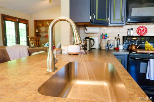 5501 Dober Ln, Saint Louis, MO 63129 - kitchen with black appliances, a sink, decorative backsplash, lofted ceiling, and blue cabinetry