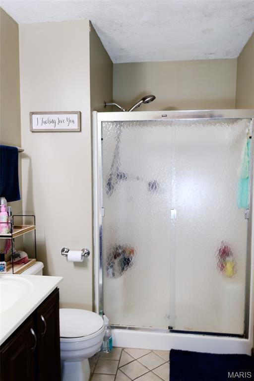 5501 Dober Ln, Saint Louis, MO 63129 - full bathroom with vanity, tile patterned floors, a stall shower, and toilet