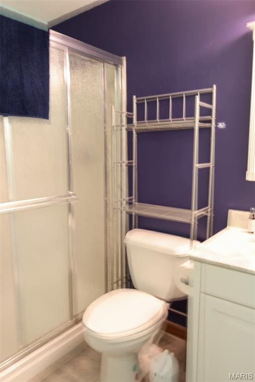 5501 Dober Ln, Saint Louis, MO 63129 - bathroom with a stall shower, vanity, toilet, and tile patterned floors