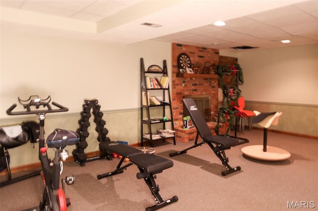 5501 Dober Ln, Saint Louis, MO 63129 - exercise area featuring carpet floors, a paneled ceiling, and baseboards