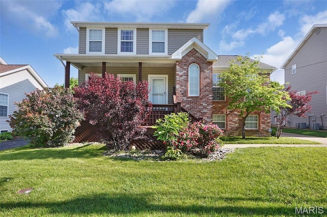 385 E Clinton Pl, Saint Louis, MO 63122 - traditional-style house featuring brick siding, a porch, and a front lawn